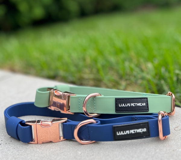 soft pvc biothane waterproof dog collar rose gold hardware in colour navy and sage with rose gold quick release buckle and rose gold D ring adjustable